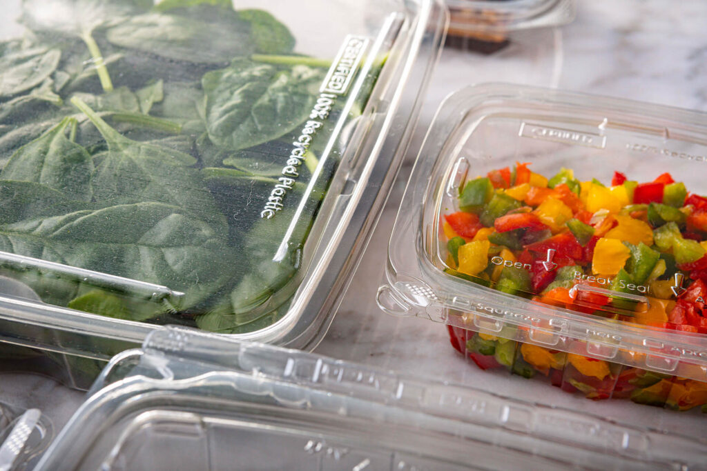 Tamper Evident clear plastic containers shown with salsa and salad