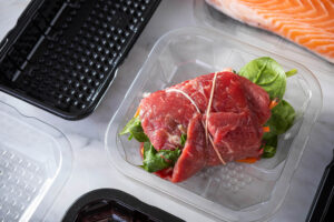 Honeycomb tray packaging plastic thermoformed protein tray with red meat and black on white